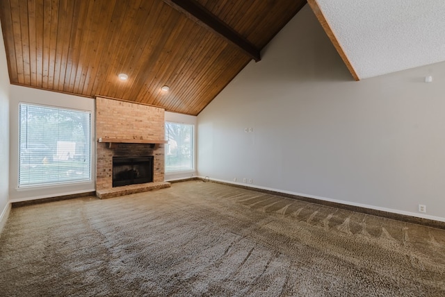 4106 Dyer Cir, Midland, TX 79707 - unfurnished living room with carpet flooring, vaulted ceiling with beams, baseboards, and wood ceiling