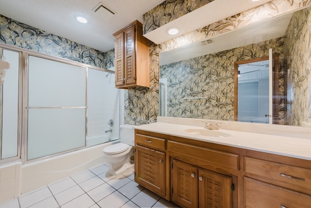 4106 Dyer Cir, Midland, TX 79707 - bathroom featuring vanity, visible vents, toilet, tile patterned floors, and combined bath / shower with glass door