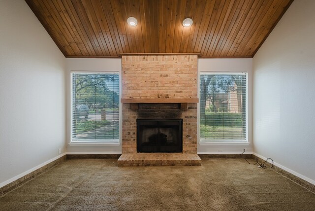 4106 Dyer Cir, Midland, TX 79707 - unfurnished living room featuring wooden ceiling, baseboards, a fireplace, and carpet flooring