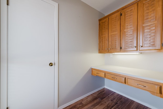 4106 Dyer Cir, Midland, TX 79707 - unfurnished office with baseboards, dark wood finished floors, and built in desk