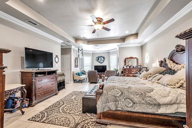 bedroom featuring light tile patterned floors, visible vents, ceiling fan, a tray ceiling, and crown molding