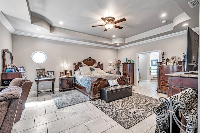 bedroom with multiple windows, visible vents, a raised ceiling, and ornamental molding
