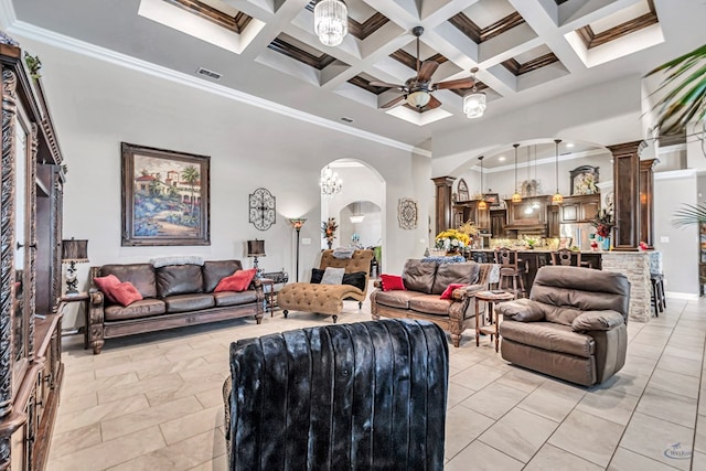living room featuring arched walkways, crown molding, visible vents, a towering ceiling, and a ceiling fan