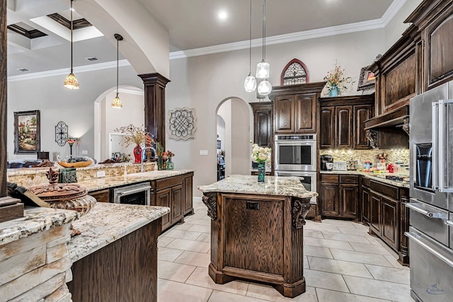 kitchen with arched walkways, ornamental molding, a sink, stainless steel appliances, and backsplash