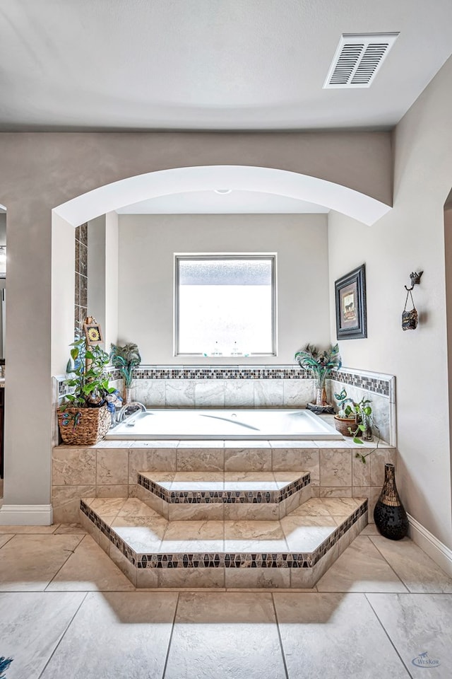 full bathroom featuring a bath and visible vents