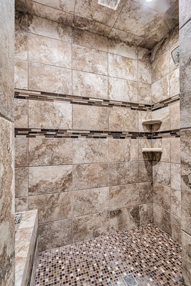 full bath with tiled shower