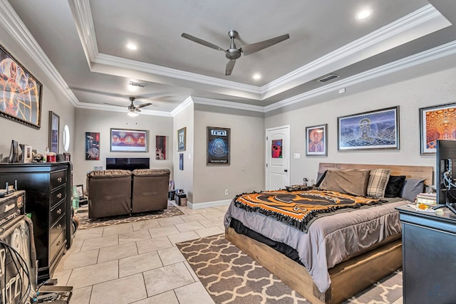 bedroom with a tray ceiling, visible vents, and crown molding