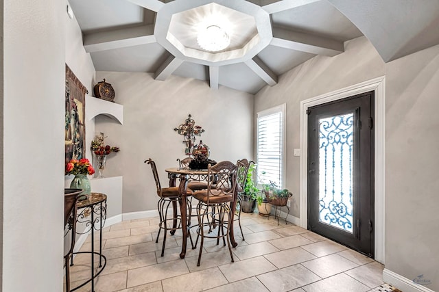tiled dining area featuring baseboards and beam ceiling