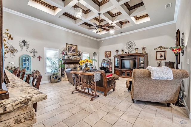 living area with visible vents, arched walkways, a ceiling fan, a high ceiling, and a fireplace