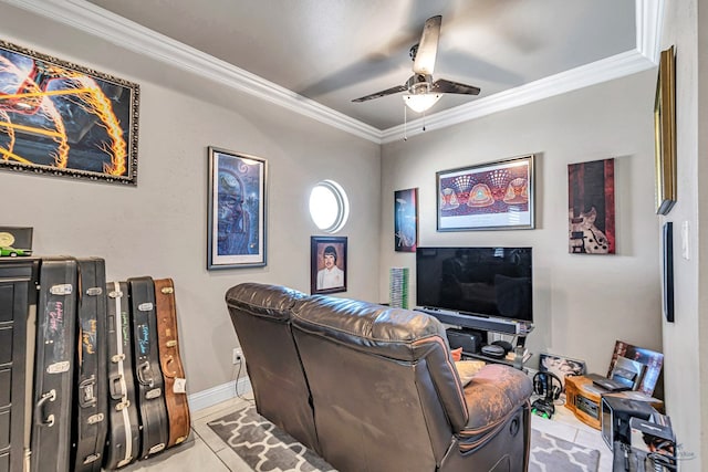 living room with light tile patterned floors, baseboards, a ceiling fan, and crown molding