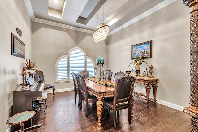 dining room featuring a tray ceiling, baseboards, dark wood-type flooring, and ornamental molding