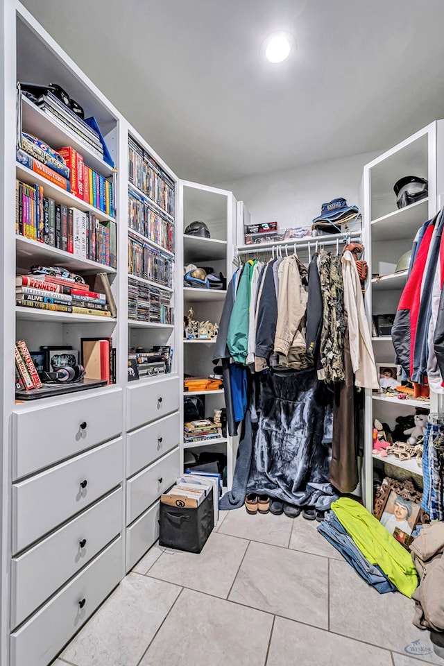 walk in closet with tile patterned flooring