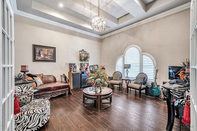 living area with crown molding, dark wood-style flooring, a raised ceiling, and a notable chandelier