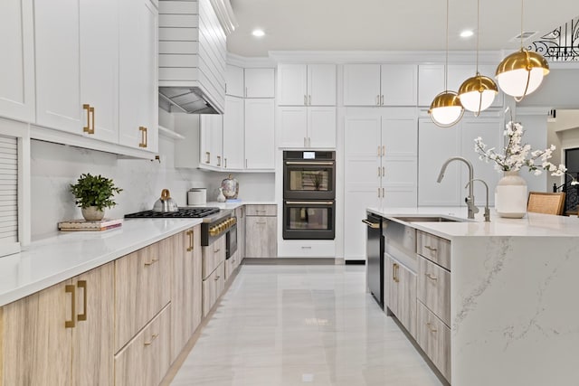 kitchen with decorative light fixtures, light stone counters, white cabinetry, and black double oven