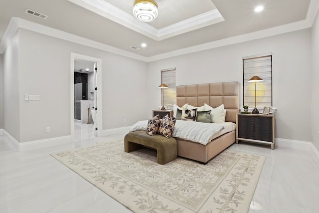 bedroom featuring ornamental molding and ensuite bath