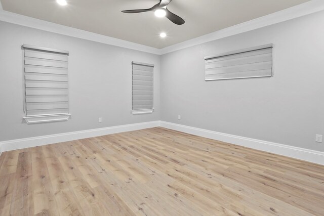 spare room with light hardwood / wood-style floors, ceiling fan, and crown molding