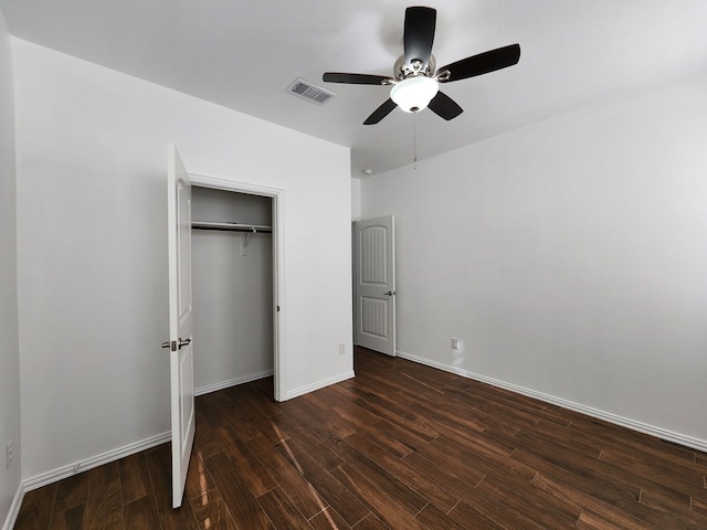 unfurnished bedroom featuring visible vents, baseboards, and wood finished floors