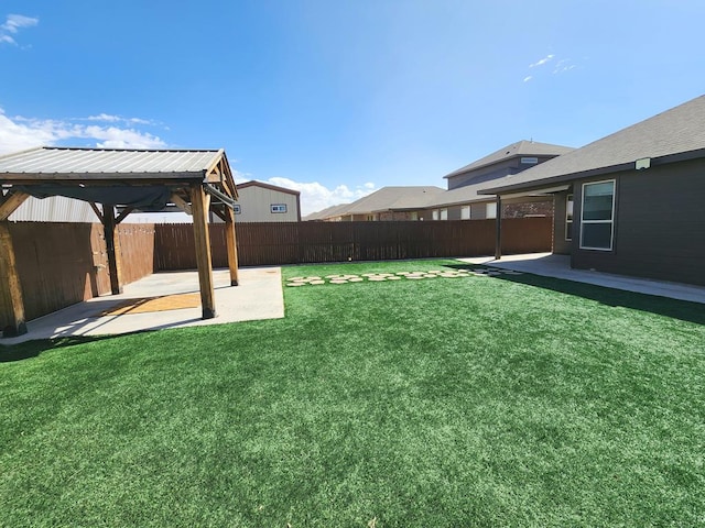 view of yard with a gazebo, a patio, and a fenced backyard