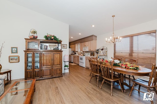 dining room featuring an inviting chandelier and light wood-type flooring