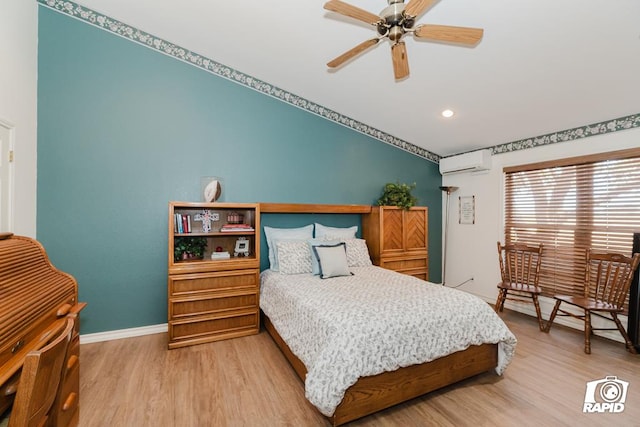 bedroom with an AC wall unit, ceiling fan, and wood-type flooring