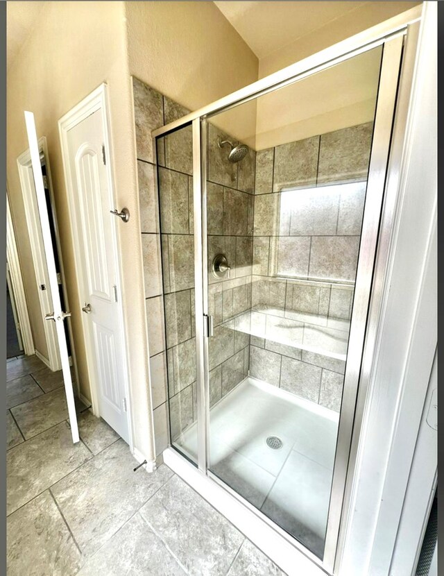 bathroom with a shower stall