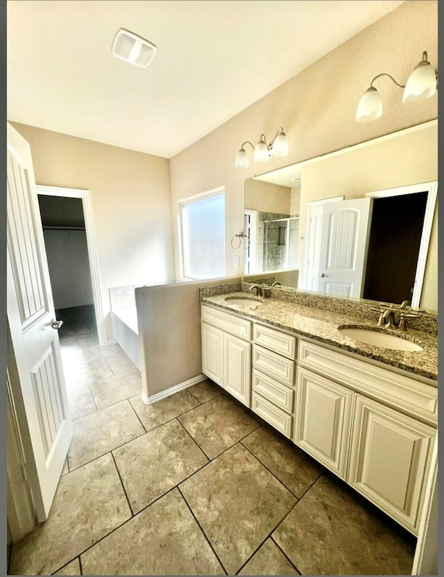 full bathroom with a shower stall, double vanity, tile patterned flooring, and a bath