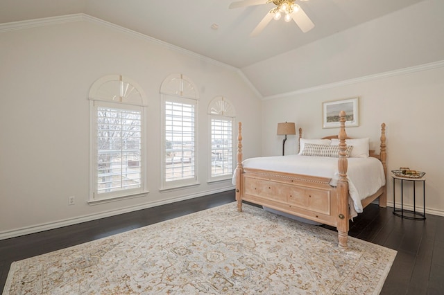 bedroom with crown molding, dark wood finished floors, vaulted ceiling, ceiling fan, and baseboards