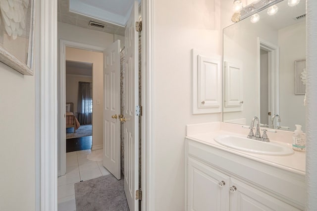 bathroom featuring tile patterned flooring, visible vents, and vanity