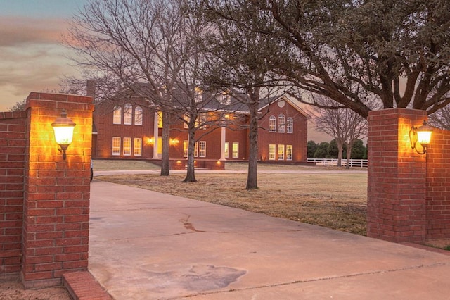 view of front of house featuring a front yard and fence