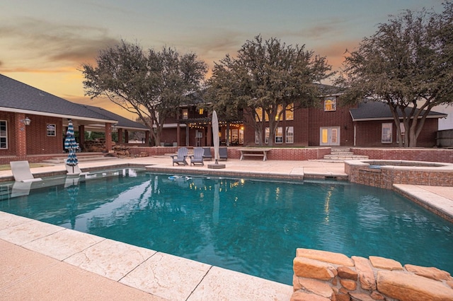 pool featuring a patio area