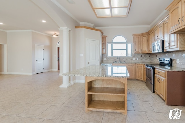 kitchen featuring open shelves, decorative backsplash, stainless steel appliances, ornate columns, and a sink