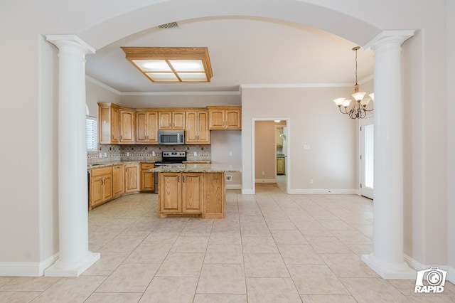 kitchen featuring light tile patterned floors, arched walkways, stainless steel appliances, crown molding, and backsplash