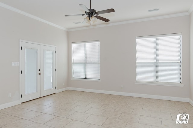 spare room featuring french doors, baseboards, a ceiling fan, and ornamental molding