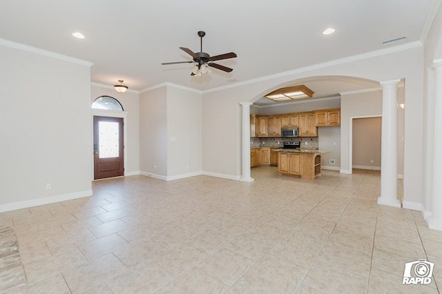 unfurnished living room featuring ornate columns, baseboards, crown molding, and a ceiling fan