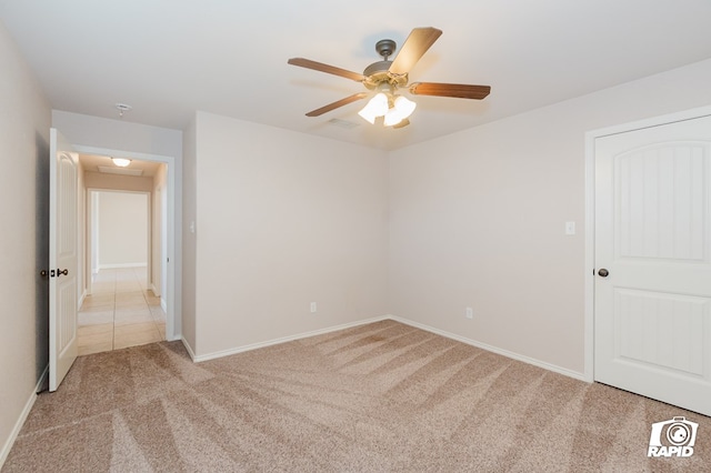 unfurnished bedroom with a ceiling fan, baseboards, and light carpet