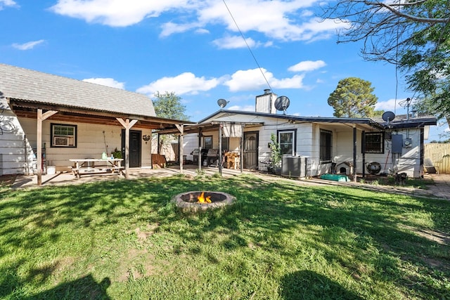 3804 Cedar Spg, Midland, TX 79703 - rear view of house with an outdoor fire pit, a patio, and a chimney