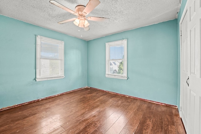 3804 Cedar Spg, Midland, TX 79703 - unfurnished bedroom with a closet, hardwood / wood-style flooring, a textured ceiling, and a ceiling fan