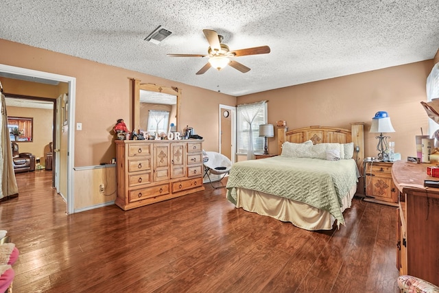 3804 Cedar Spg, Midland, TX 79703 - bedroom featuring wood finished floors, a textured ceiling, and a ceiling fan