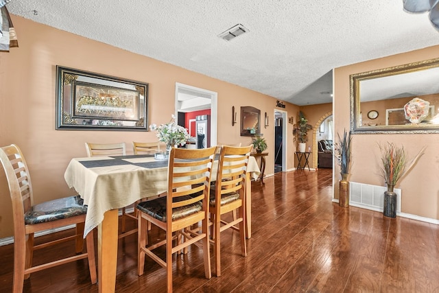 3804 Cedar Spg, Midland, TX 79703 - dining area with a textured ceiling, wood finished floors, and healthy amount of natural light