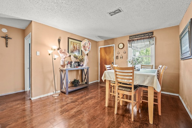 3804 Cedar Spg, Midland, TX 79703 - dining room featuring a textured ceiling and wood finished floors