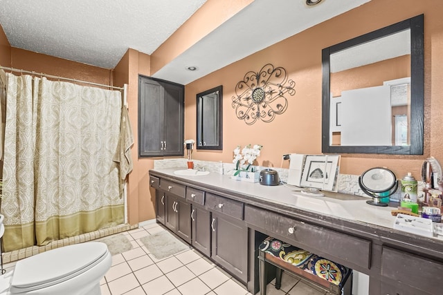 3804 Cedar Spg, Midland, TX 79703 - bathroom featuring double vanity, tile patterned floors, curtained shower, and a textured ceiling