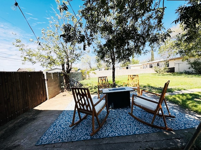 view of patio with an outdoor fire pit