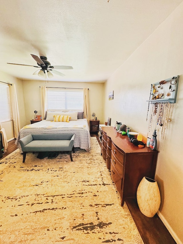 bedroom featuring hardwood / wood-style floors and ceiling fan