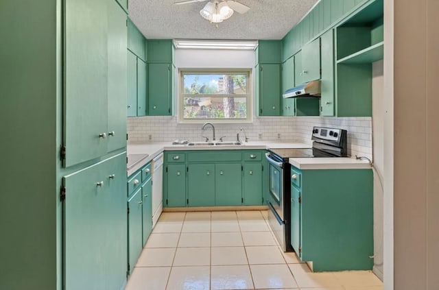 kitchen with a textured ceiling, sink, stainless steel range with electric stovetop, light tile patterned flooring, and ceiling fan