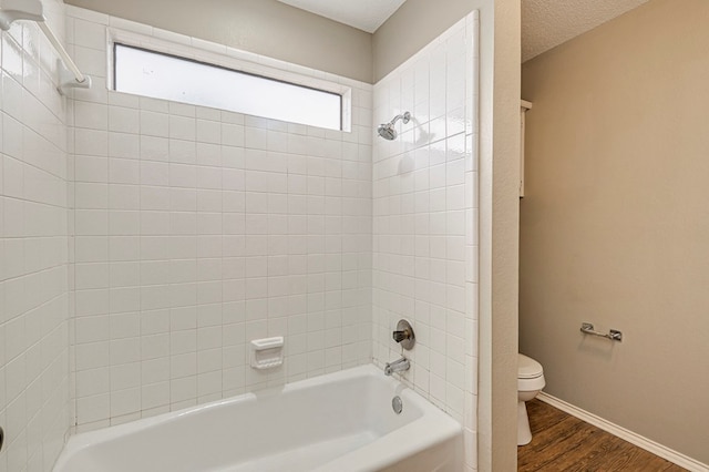 3205 Dentcrest Dr Unit B, Midland, TX 79707 - bathroom with toilet, wood finished floors, shower / bathtub combination, and baseboards