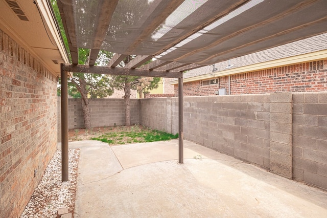 3205 Dentcrest Dr Unit B, Midland, TX 79707 - fenced backyard with a patio and a pergola