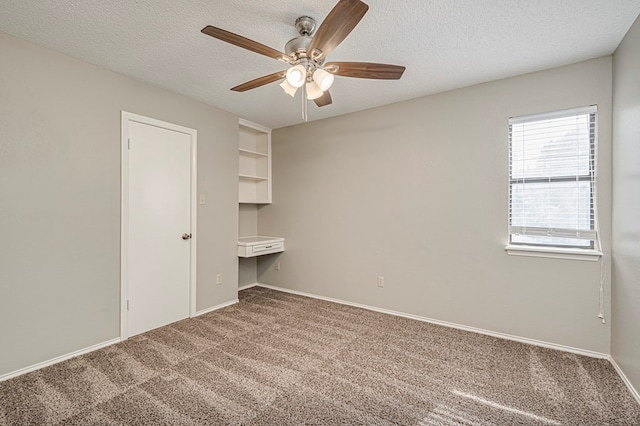 3205 Dentcrest Dr Unit B, Midland, TX 79707 - carpeted empty room featuring ceiling fan, a textured ceiling, and baseboards