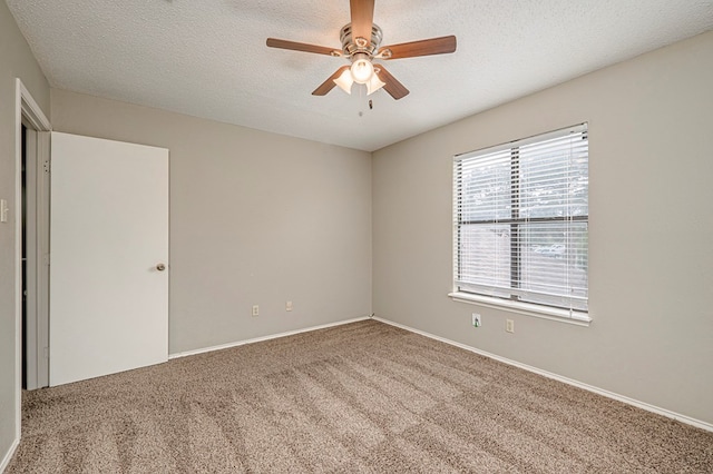 3205 Dentcrest Dr Unit B, Midland, TX 79707 - carpeted spare room with a ceiling fan, baseboards, and a textured ceiling