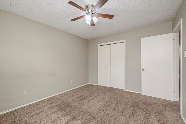 3205 Dentcrest Dr Unit B, Midland, TX 79707 - unfurnished bedroom with carpet flooring, a textured ceiling, a closet, a ceiling fan, and baseboards