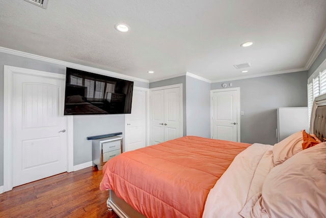 1002 Boyd Ave, Midland, TX 79705 - bedroom featuring recessed lighting, crown molding, baseboards, and wood finished floors